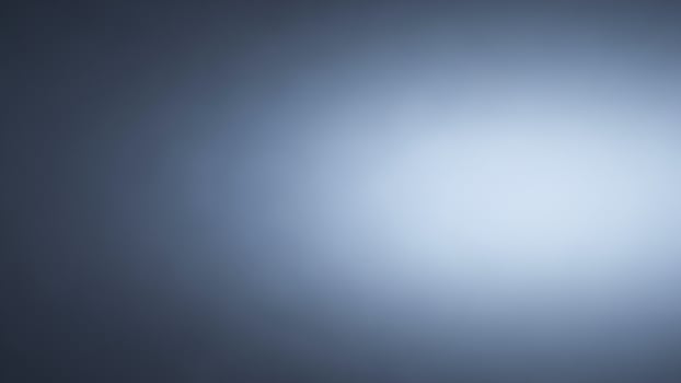 A blurry image of a light bulb in a dark room photo