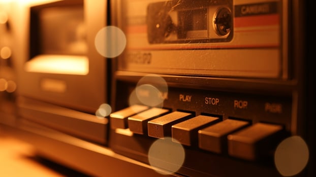An old cassette player is sitting on a table photo