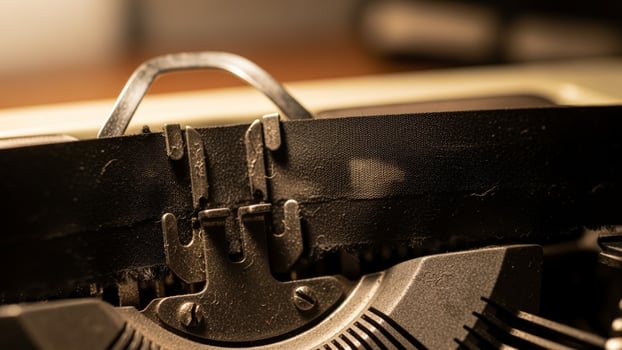 An old typewriter with a metal handle photo