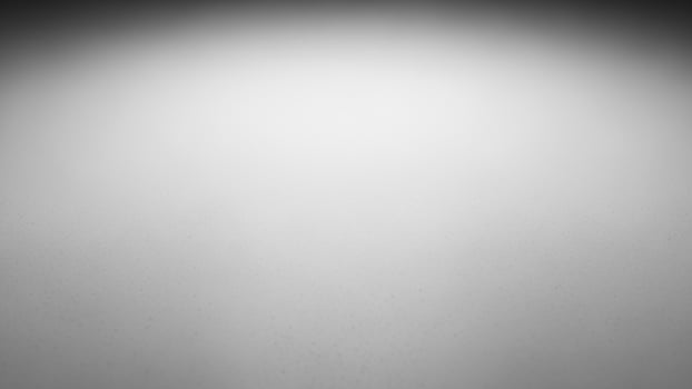 Black and white photo of a person walking in the dark