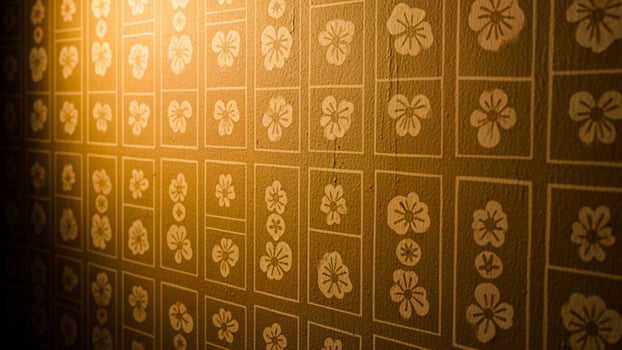 A wall with a pattern of flowers on it photo