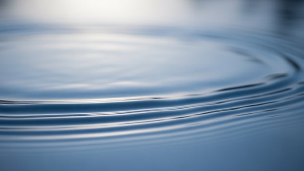 Water ripples on a blue surface photo