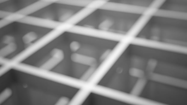 A black and white photo of a metal grate
