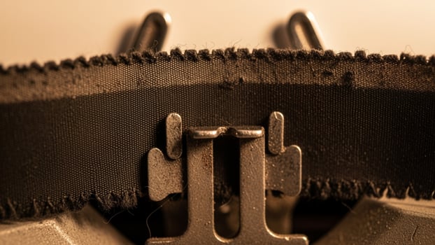 A close up of a typewriter with a belt photo