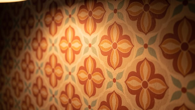 A close up of a wall with a patterned design photo