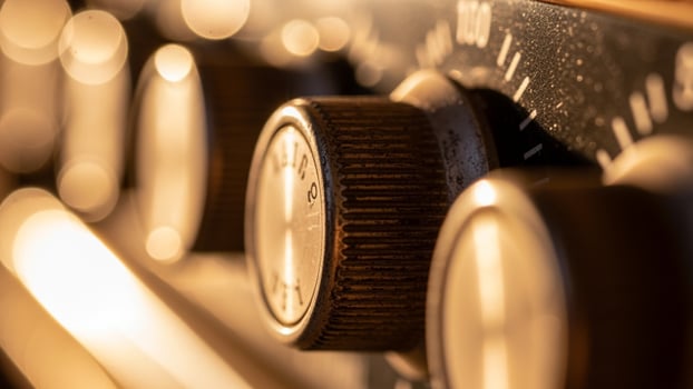 Close up of the knobs on an old radio photo
