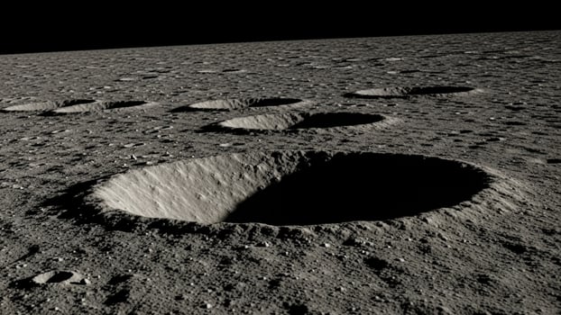 A crater on the moon with several small holes photo