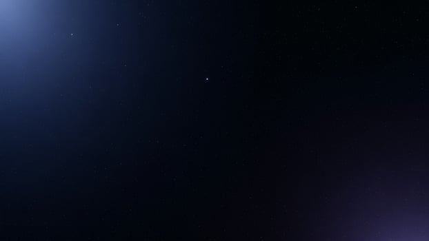 A bright blue light is shining in the dark photo