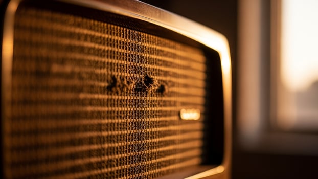 An old television is shown in front of a window photo