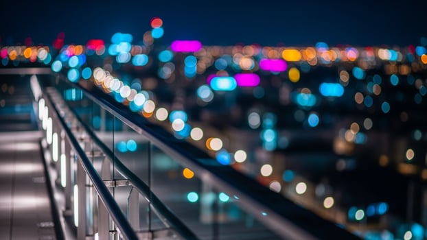 A cityscape with lights and buildings at night photo