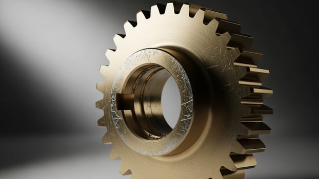 A golden gear on a gray background abstract background photo