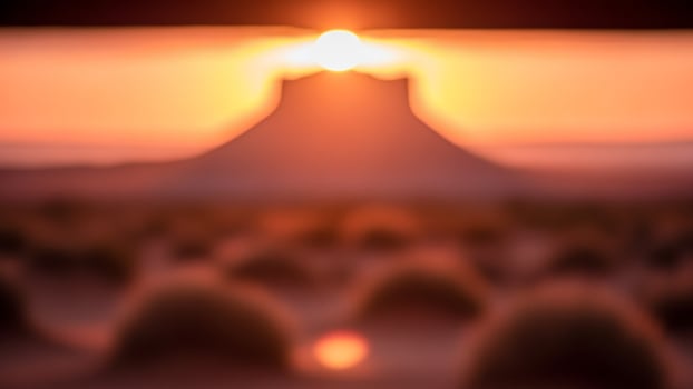 A blurry image of a sunset over a desert photo