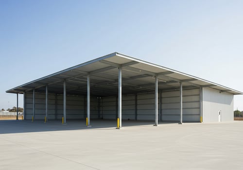 Empty metal structure on concrete slab for industrial or storage purpose photo