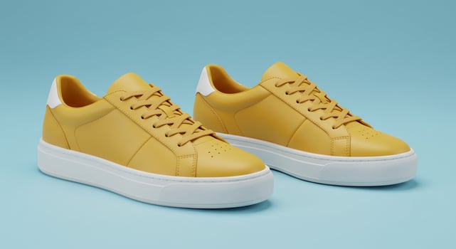 Mustard casual sneakers on light blue, footwear marketing for fashion promotion photo