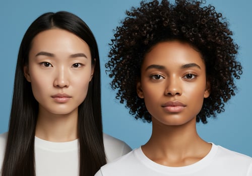 Portraits of multiethnic women expressing unity against a blue studio backdrop photo