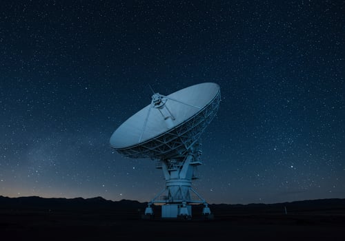 Radio telescope pointing to the night sky for searching extraterrestrial life photo