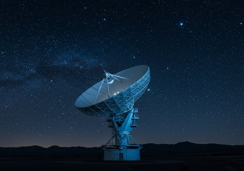 Satellite dish communication at night transmitting a signal in the starry sky photo