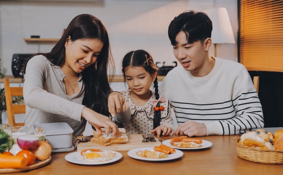 A family eating breakfast together photo