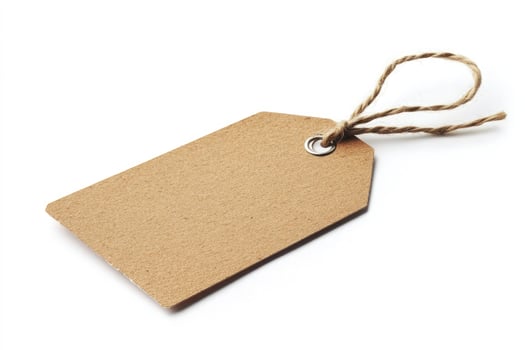 Blank brown paper tag with twine isolated on white background photo