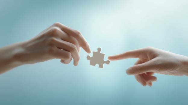 The hands connecting a puzzle piece symbolizing collaboration and unity. photo