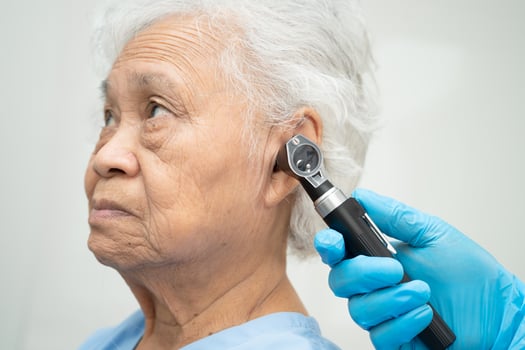 Otolaryngologist or ENT physician doctor senior ear photo
