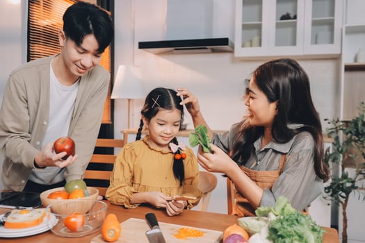 Asian family preparing vegetables for dinner photo