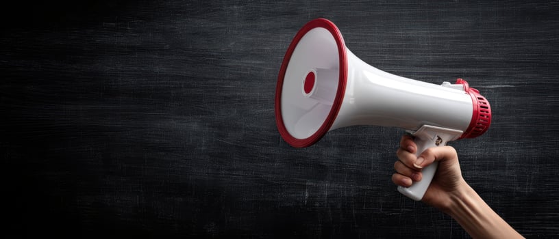 The megaphone held high advocating for change and engagement in communication. photo