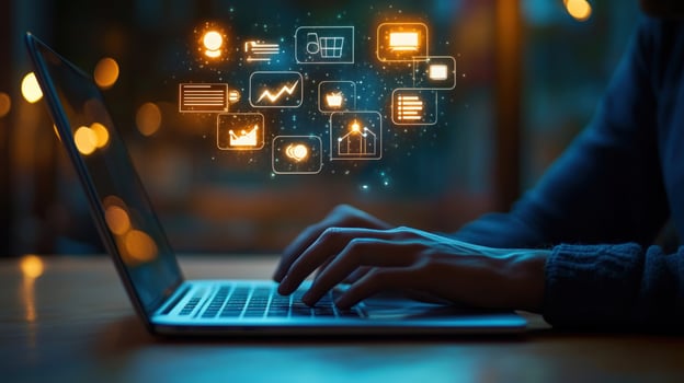 Man typing on laptop with icons on screen photo
