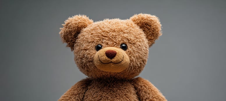 The adorable teddy bear with warm expression and soft fur. photo