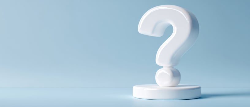 The white question mark on a soft blue background creating an abstract concept. photo