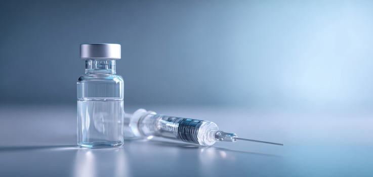 The vaccine bottle and syringe representing modern medical advancements and health initiatives. photo