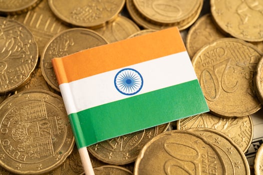 India flag on coins background for finance banking business. photo