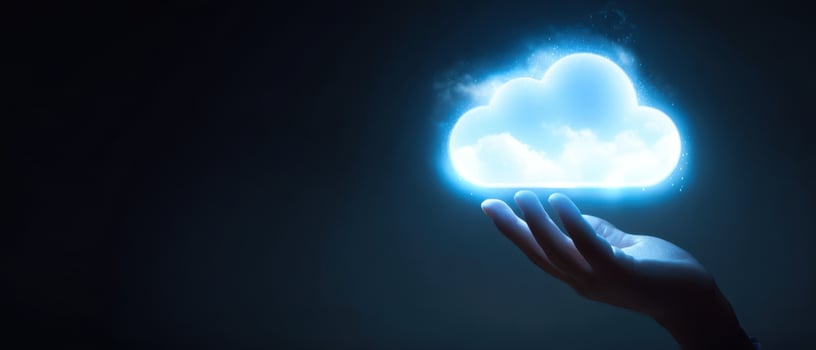 The hand holding a glowing cloud symbolizing digital innovation and connectivity. photo