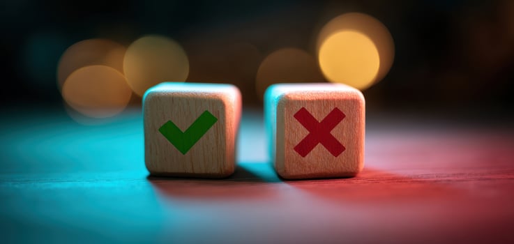 The wooden blocks representing approval and rejection with colorful bokeh background. photo