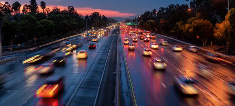 The busy highway illuminated by evening lights and vibrant sunset colors. photo