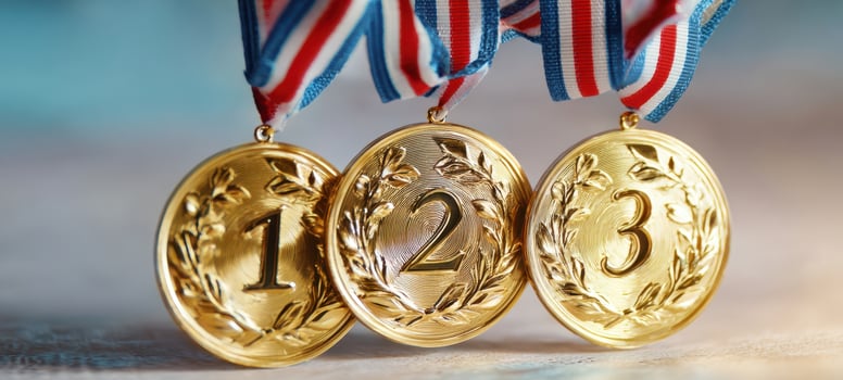 The golden medals representing achievement and victory in sports competitions. photo