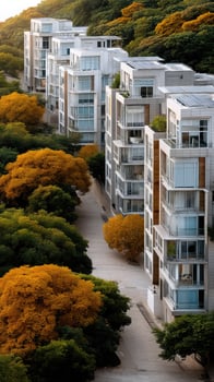 A row of apartment buildings with trees in the background photo