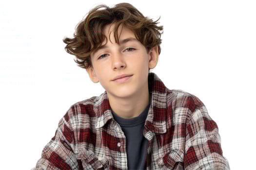 Portrait of young boy with curly hair wearing plaid flannel shirt on white background photo