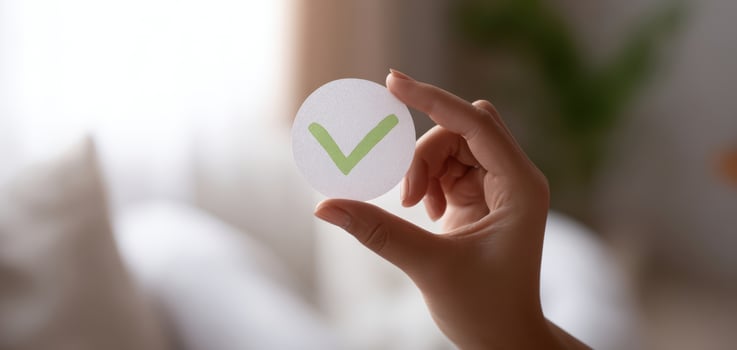 The hand holding a checkmark symbol of approval and success. photo