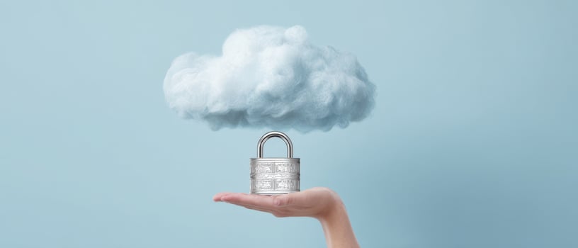 The hand holding a padlock under a floating cloud representing security and privacy. photo