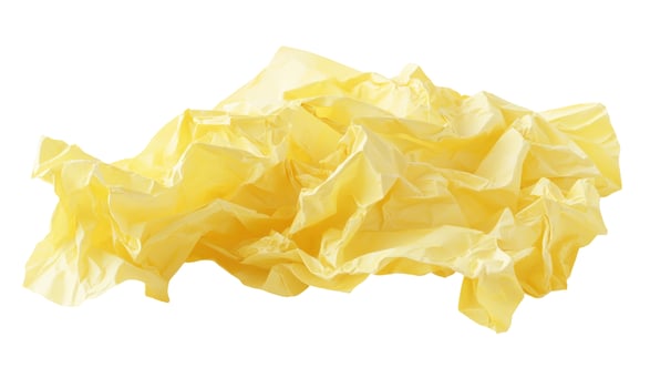 Crumpled light yellow paper texture isolated on white background photo