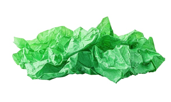 Crumpled light green tissue paper texture on white background photo