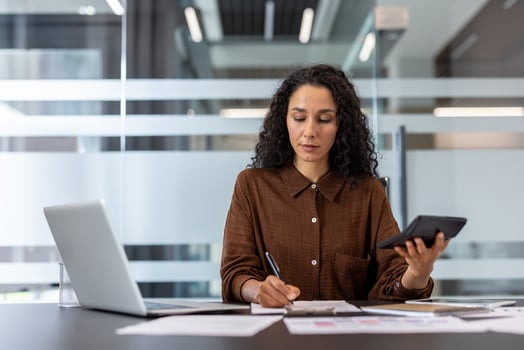 Businesswoman analyzing data at office photo