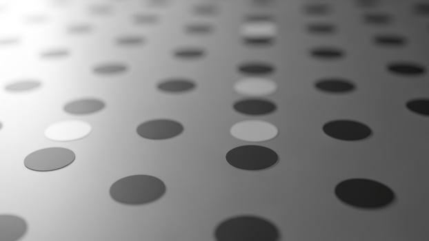 A black and white photo of a polka dot pattern
