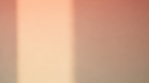 A close up of a wall with a red and orange stripe photo