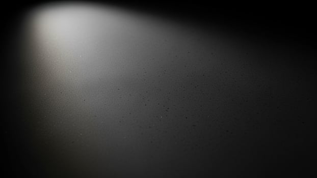a sl a ck s a ckground with a light shining on it photo