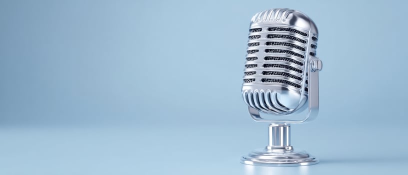 The vintage microphone on a smooth, light blue background for audio enthusiasts. photo