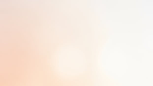 A white and orange background with a blurred image photo