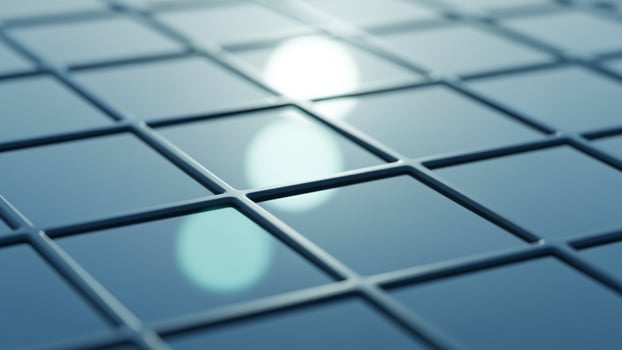 A close up of a glass tile floor with a light shining through photo