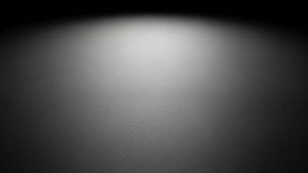 sl a ck a nd white photo of a light shining on a w a ll